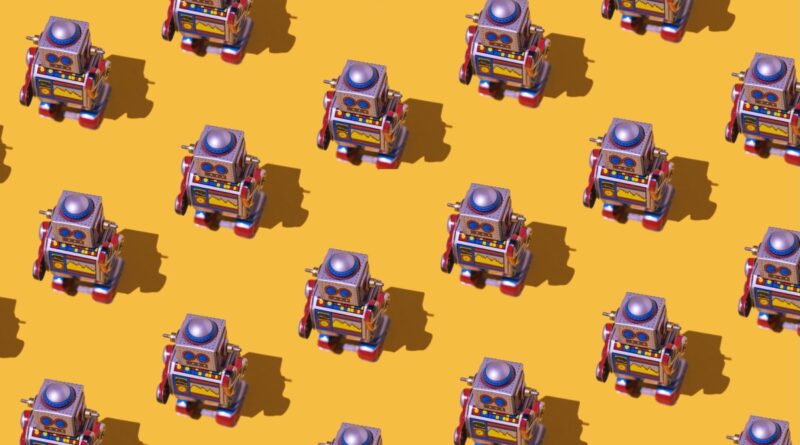 Pattern of retro tin toy robots with clocks and displays painted on yellow background.