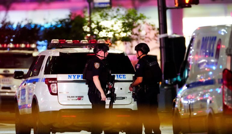 Police officers near the scene of a shooting in the Manhattan borough of New York