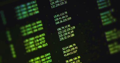 a stock photo of a list of random IP addresses in green text on a computer monitor at an angle