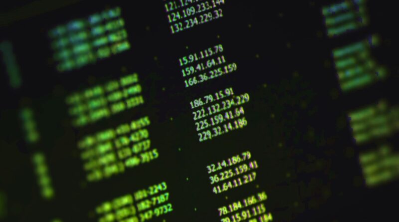 a stock photo of a list of random IP addresses in green text on a computer monitor at an angle