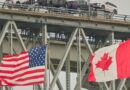 A truck carrying vehicles crosses the Blue Water Bridge into the US from Sarnia, Ontario