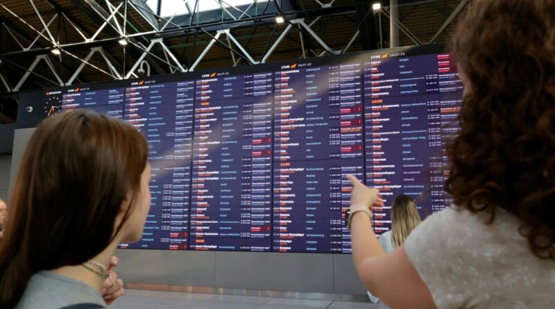 People wait for their flights at the Sheremetyevo International Airport on the outskirts of Moscow on July 28, 2025. A cyberattack on Russia's national airline Aeroflot grounded 42 flights on July 28, officials said, with a Ukrainian and a Belarusian hacker group claiming responsibility for the incident.