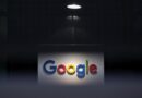 a photo of Google's logo on a dark background