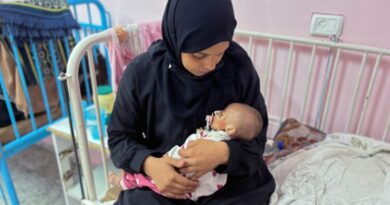 Palestinian mother Israa Abu Haleeb looks after her five-month-old daughter, Zainab, who is diagnosed with malnutrition, according to medics, at Nasser hospital in Khan Younis [File: Hussam Al-Masri/Reuters]