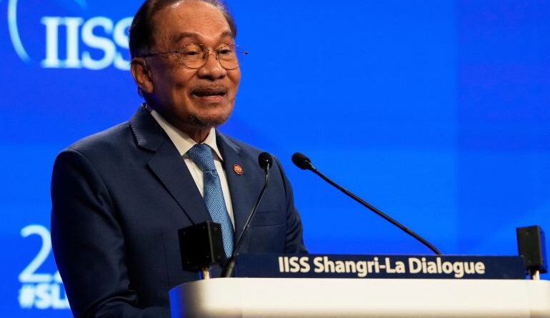 Malaysian Prime Minister Anwar Ibrahim delivers a speech.