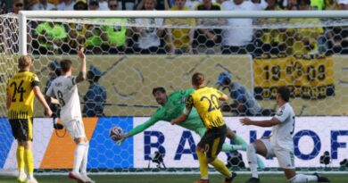 Real Madrid's Thibaut Courtois saves a shot from Borussia Dortmund's Marcel Sabitze