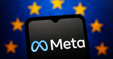 The Meta Platforms logo is seen displayed on a smartphone screen and the flag of the European Union in the background.
