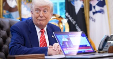 President Donald Trump,shows a news video from a laptop in the Oval Office of the White House on May 30, 2025 in Washington, DC.