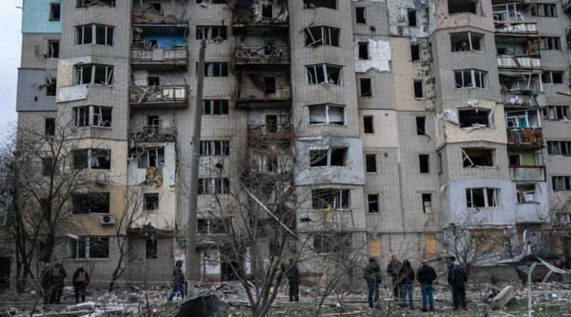 Residents assess the damage to buildings in Kupiansk, in the Kharkiv region of Ukraine. (file photo)