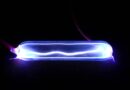 Electricity lights up krypton gas, showing a plasma discharge.