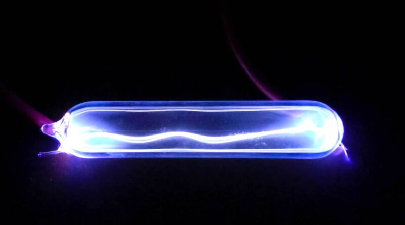 Electricity lights up krypton gas, showing a plasma discharge.