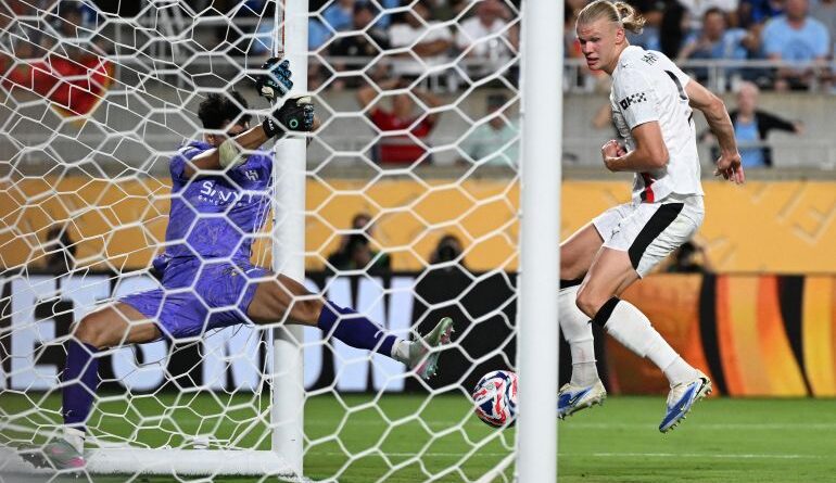 Manchester City's Norwegian striker #09 Erling Haaland shoots but fails to score against Al Hilal's Moroccan goalkeeper #37 Yassine Bounou during the FIFA Club World Cup 2025 round of 16 football match between England's Manchester City and Saudi's Al-Hilal at the Camping World stadium in Orlando on June 30, 2025. (Photo by PATRICIA DE MELO MOREIRA / AFP)
