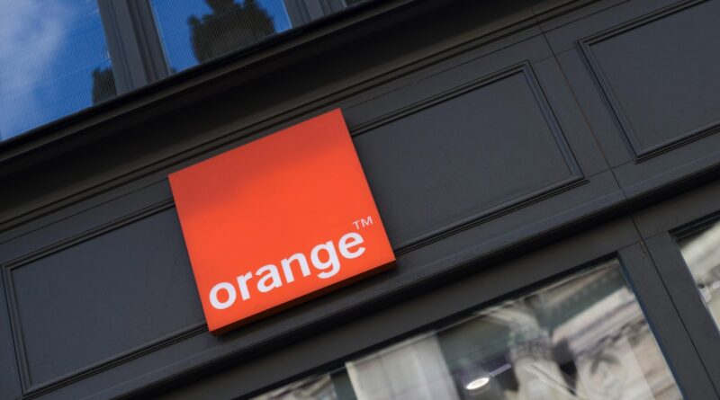 An Orange SA logo sits on display outside the Orange Paris Opera boutique mobile phone store in Paris, France, on Wednesday, July 29, 2020.