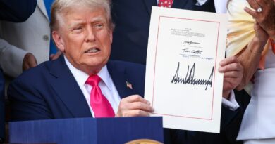 U.S. President Donald Trump, joined by Republican lawmakers, signs the One, Big Beautiful Bill Act into law during an Independence Day military family picnic on the South Lawn of the White House on July 04, 2025 in Washington, DC.