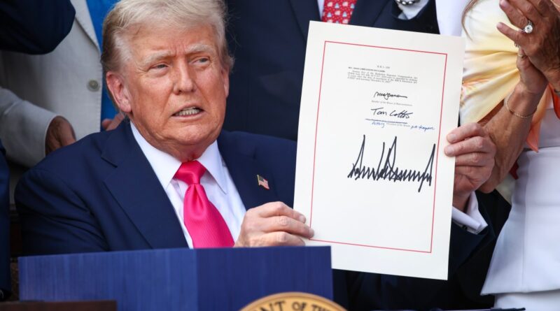 U.S. President Donald Trump, joined by Republican lawmakers, signs the One, Big Beautiful Bill Act into law during an Independence Day military family picnic on the South Lawn of the White House on July 04, 2025 in Washington, DC.