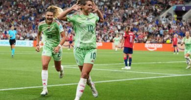 Italy's Cristiana Girelli cups her ears in celebration after scoring a 90th-minute winter against Norway to send her team to the Euro 2025 semifinals.