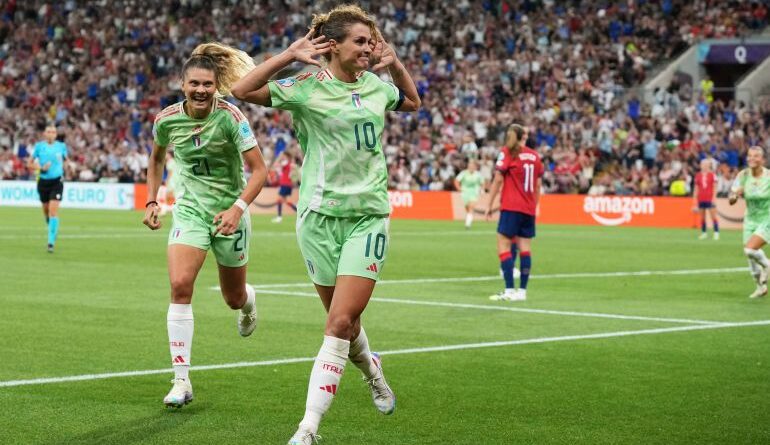 Italy's Cristiana Girelli cups her ears in celebration after scoring a 90th-minute winter against Norway to send her team to the Euro 2025 semifinals.