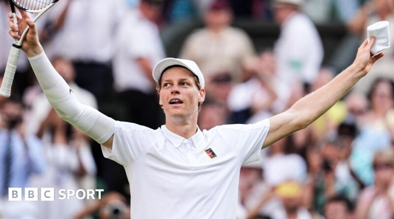 Jannik Sinner crouches to the ground after securing his first Wimbledon title