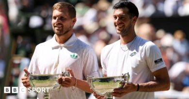 Lloyd Glasspool and Julian Cash after their Wimbledon men's doubles win on Centre Court Wimbledon