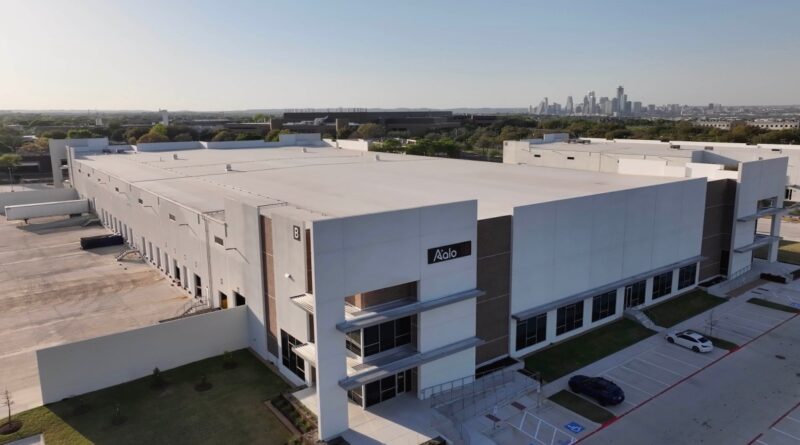 Aalo Atomics factory seen from the air with Austin's skyline in the background.