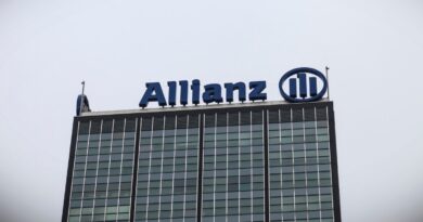 a photo of Allianz's logo at the top of a building.