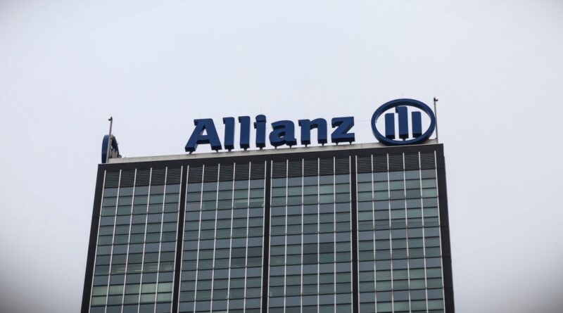 a photo of Allianz's logo at the top of a building.
