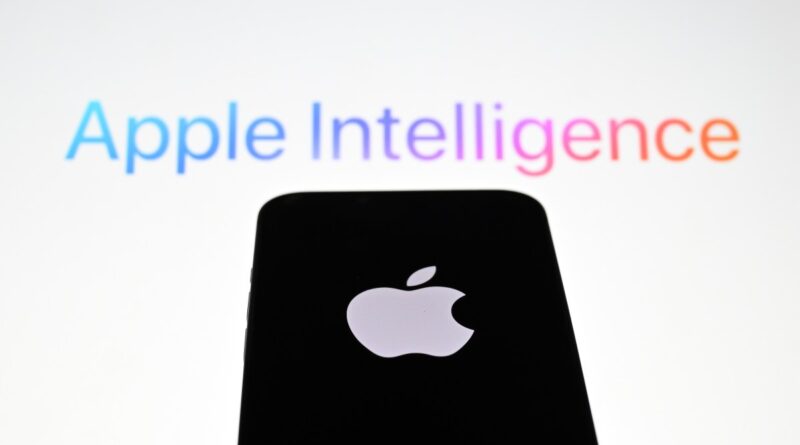 In this photo illustration, the 'Apple' logo is displayed on a mobile phone screen in front of a computer screen displaying Apple Intelligence logo.