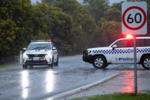 Police cars in rain