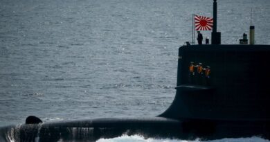 Sailors stand aboard the Kokuryu submarine of the Japanese Maritime Self-Defense Force (JMSDF) during its fleet review at Sagami Bay, off Yokosuka, south of Tokyo October 15, 2015. REUTERS/Thomas Peter
