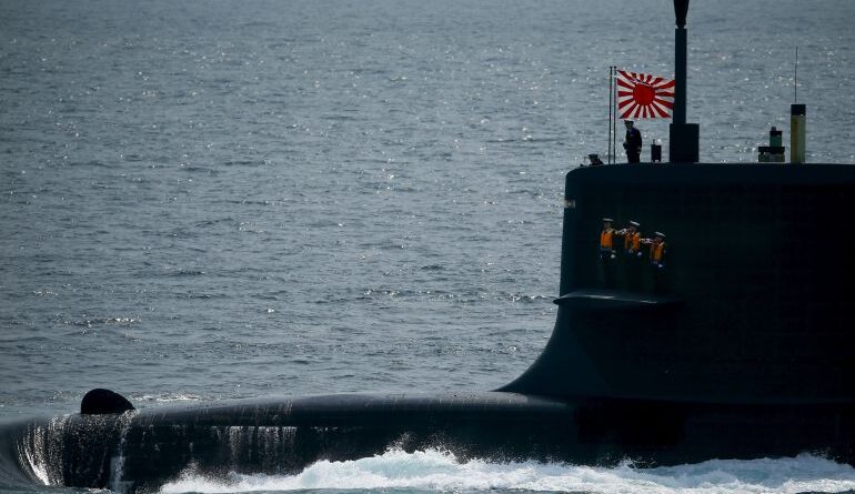 Sailors stand aboard the Kokuryu submarine of the Japanese Maritime Self-Defense Force (JMSDF) during its fleet review at Sagami Bay, off Yokosuka, south of Tokyo October 15, 2015. REUTERS/Thomas Peter