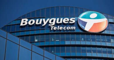 a logo outside the headquarters of Bouygues Telecom, against a blue sky background