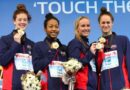 Members of the US relay team (L-R) Allison Schmitt, Lia Neal, Jessica Hardy and Megan Romano pose with their gold medals on the podium after winning the women's 4x100m freestyle relay final during the Short Course Swimming World Championships