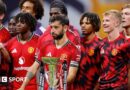 Manchester United players stand next to the Premier League Summer Series trophy