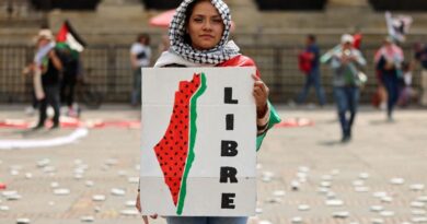 A protester holds a sign during a demonstration demanding an immediate ceasefire in Gaza, as the conflict between Israel and the Palestinian Islamist group Hamas continues, in Bogota, Colombia, January 27, 2024. REUTERS/Luisa Gonzalez TPX IMAGES OF THE DAY
