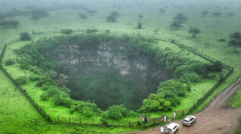 Mind the gap: tourists drawn to Oman's giant sinkholes