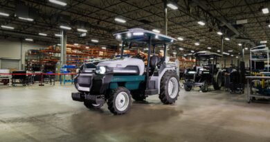 Monarch Tractor's robot tractor in a warehouse