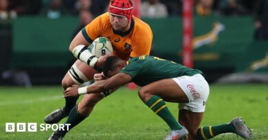 Australia's Harry Wilson is tackled