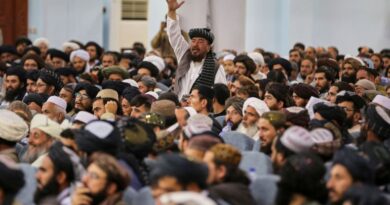 A man shouts during a meeting of delegates that opens Victory Day celebrations at Loya Jirga Hall in Kabul
