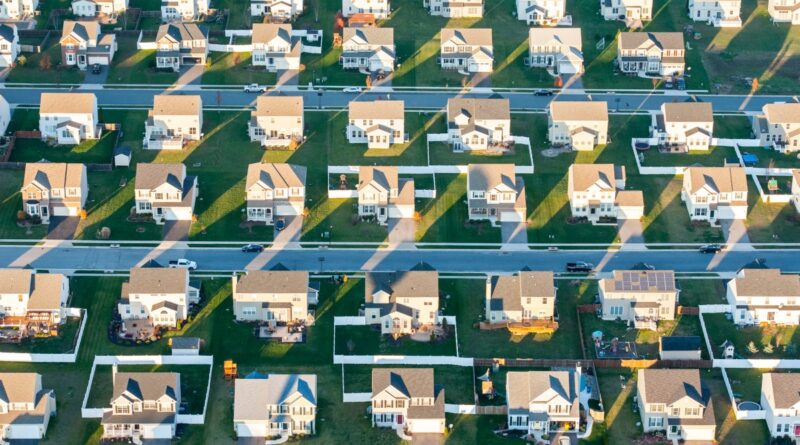 An oblique aerial view of suburban houses.