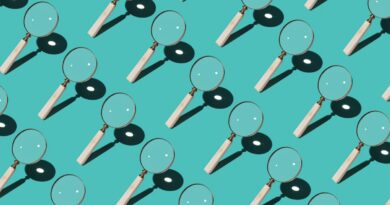 Magnifying Glass Focusing Sunlight Into a Point Repetition on Turquoise Colored Background High Angle View.