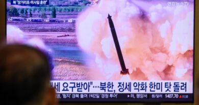 a photo of a tv screen in South Korea showing the broadcast and chryon of a North Korean missile launch.