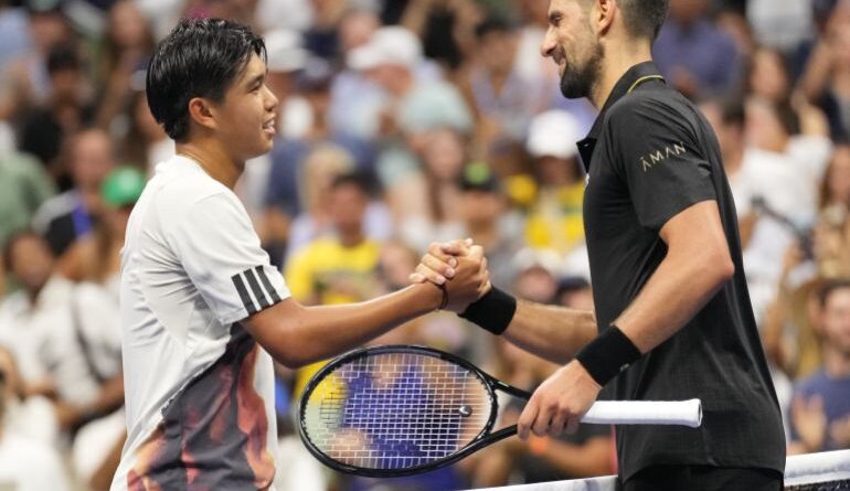 Novak Djokovic and Learner Tien shake hands.
