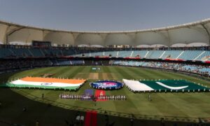 Indian, left, and Pakistan players stand for their national anthem before the start of the ICC Women's T20 World Cup 2024 match between Pakistan and India at Dubai International Stadium, United Arab Emirates, Sunday, Oct. 6, 2024. (AP Photo/Altaf Qadri)