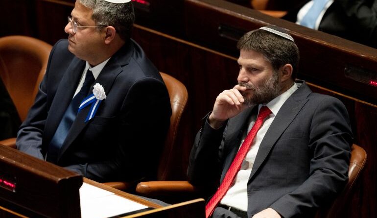 Israeli right wing Knesset member Itamar ben Gvir (L) and Bezalel Smotrich (R) are pictured during the swearing in ceremony of the new Israeli government at the Knesset (Israeli parliament) in Jerusalem, on November 15, 2022. Israel swore in a new parliament today hours after a deadly attack, as veteran hawk Benjamin Netanyahu advances talks on forming what could be the country's most right-wing government ever. (Photo by Maya Alleruzzo / POOL / AFP)