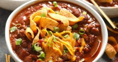 Three bowls of the best chili, served with tortilla chips.