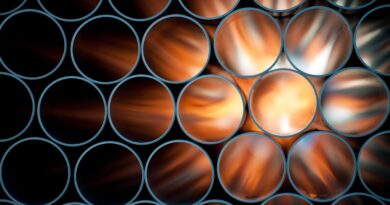 Pipes are backlit, causing them to appear to glow orange.