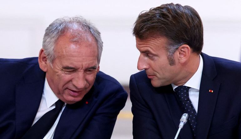 FILE -French President Emmanuel Macron, left, and Prime Minister Francois Bayrou attend a meeting with New Caledonia's elected officials and state representatives who have concluded a historic agreement allowing the creation of a "State of New Caledonia" within the French Republic, at the Elysee Palace in Paris, July 12, 2025. (Tom Nicholson, Pool Photo via AP, File)