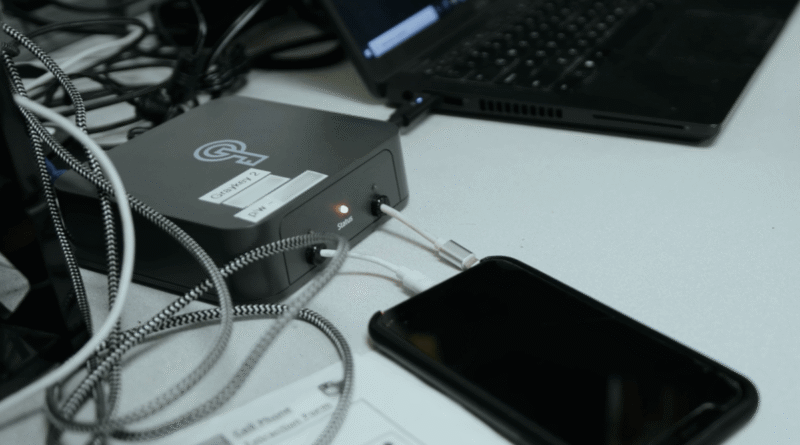 A man operates a Graykey phone hacking and unlocking device, made by Magnet Forensics. (Image: Magnet Forensics)