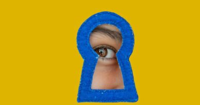 a child looking through a blue keyhole