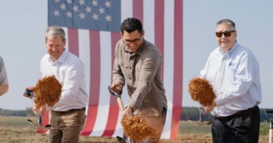 Governor Brian Kemp and Rivian CEO RJ Scaringe break ground at the planned Georgia factory.